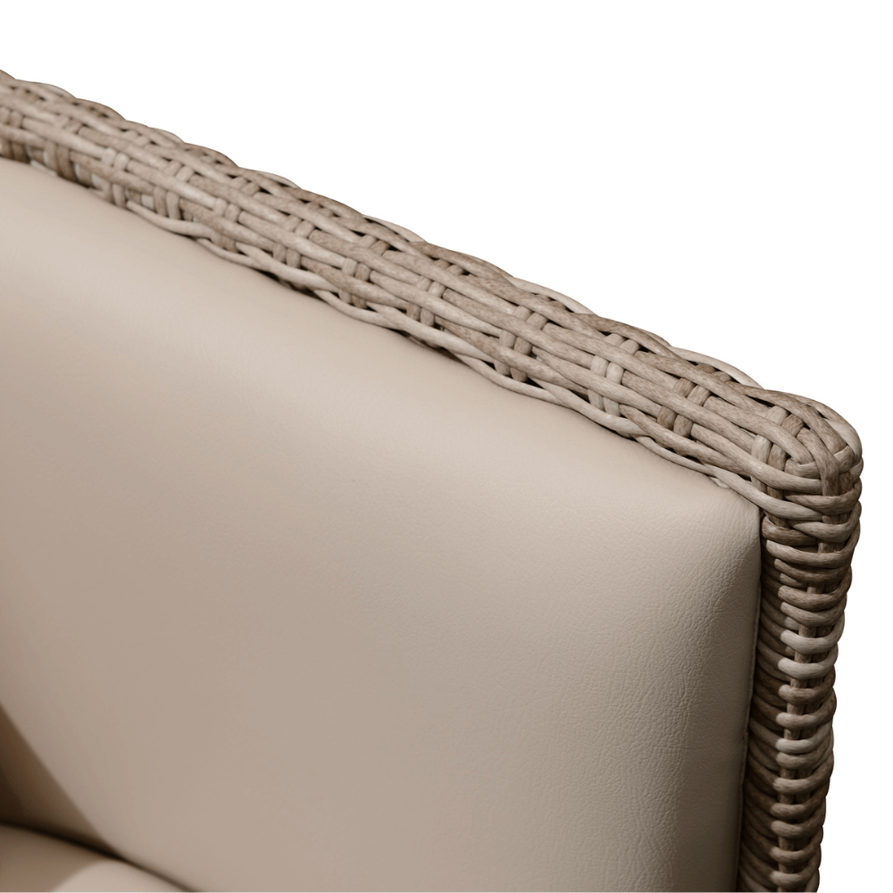 The beige outdoor wicker sofa features intricate weaving details, with beige wicker strands carefully crafted to form the frame and edges of the sofa. The cushions are a light beige color, with a smooth and even texture, providing both comfort and a stylish look.