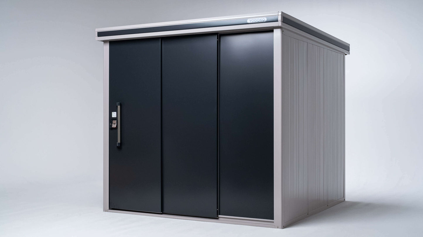 The YODOKO Premium Outdoor Large Shed LMDS by BON PERGOLA boasts a sleek, minimalist design with a dark sliding door and light gray panels. Enhanced by Japanese craftsmanship, its perfect for storing tools or garden equipment against a plain background.