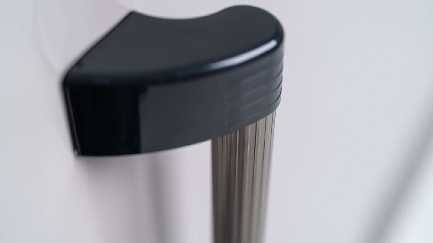 Close-up of YODOKO Premium Outdoor Large Shed LMDS from BON PERGOLA, featuring a metallic handle with a black curved plastic grip, highlighting Japanese craftsmanship. The shiny pole and durable coating enhance resilience, while the out-of-focus background complements its sleek design.