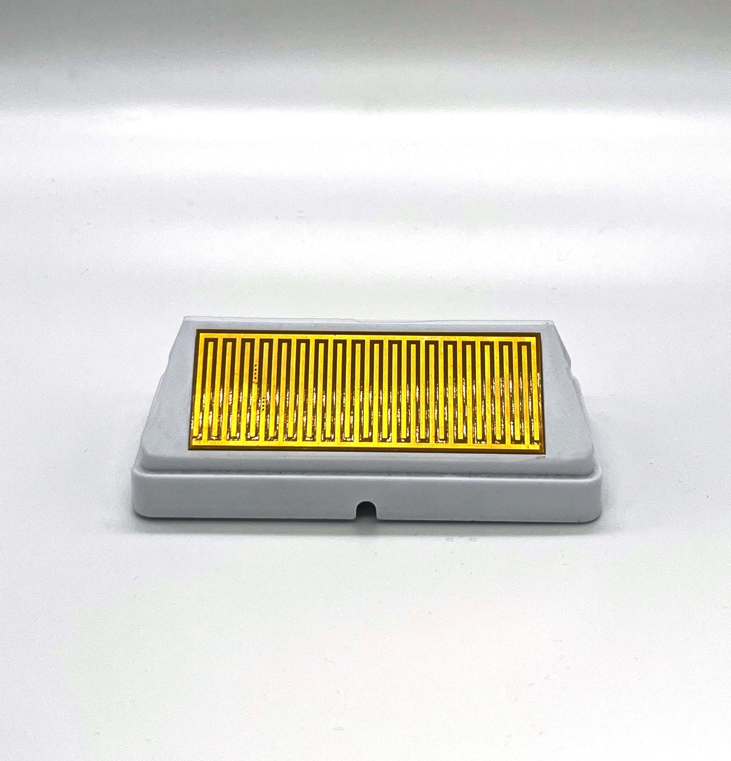 The Bon Pergola electric louvered roof is equipped with a rain sensor for smart rain protection. This compact sensor is designed for outdoor use, featuring a rectangular metal sensing area with serpentine-patterned parallel metal stripes, forming a capacitive sensing structure. When raindrops fall between the stripes, the resulting change in capacitance is detected by the sensor, automatically triggering the louvers to close, ensuring a dry and safe space below.