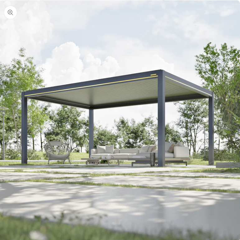 A dark gray aluminum pergola kit with adjustable louvered roof panels shades a white outdoor sofa and lounge seating.