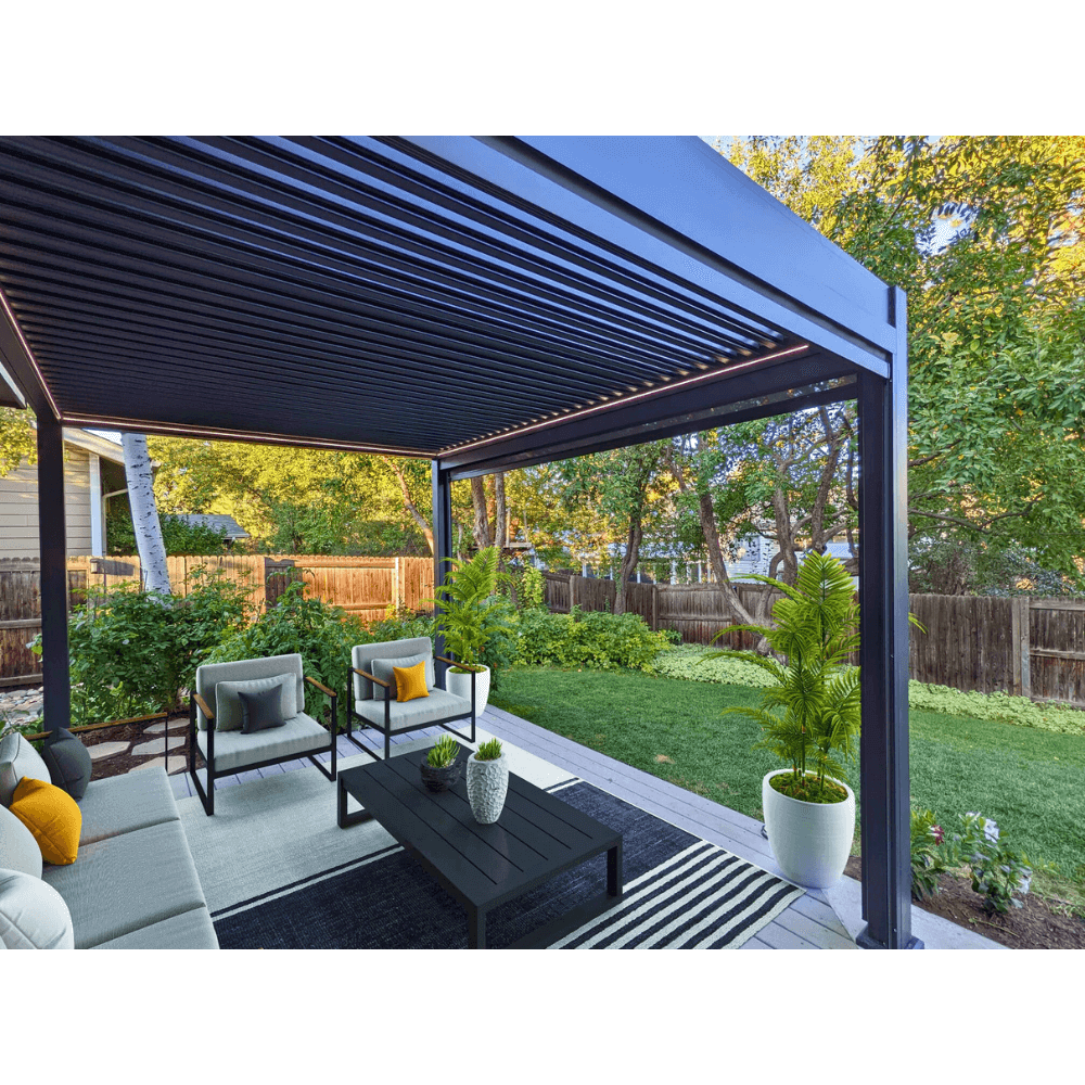 The dark gray Bon Pergola features partially open louvers, revealing their linear structure. Built with sturdy dark gray beams and columns, it has a clean, modern look. Warm yellow LED light strips line the edges, softly illuminating the space below and casting a gentle glow across the wooden deck.
