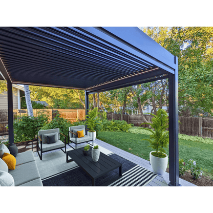The dark gray Bon Pergola features partially open louvers, revealing their linear structure. Built with sturdy dark gray beams and columns, it has a clean, modern look. Warm yellow LED light strips line the edges, softly illuminating the space below and casting a gentle glow across the wooden deck.