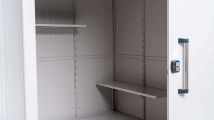 The YODOKO Premium Outdoor Large Shed LMDS by BON PERGOLA features a metal cabinet with two shelves, showcasing elegant Japanese craftsmanship. Its door is partially open with a black handle and lock on the right side, revealing its sturdy interior and durable coating.