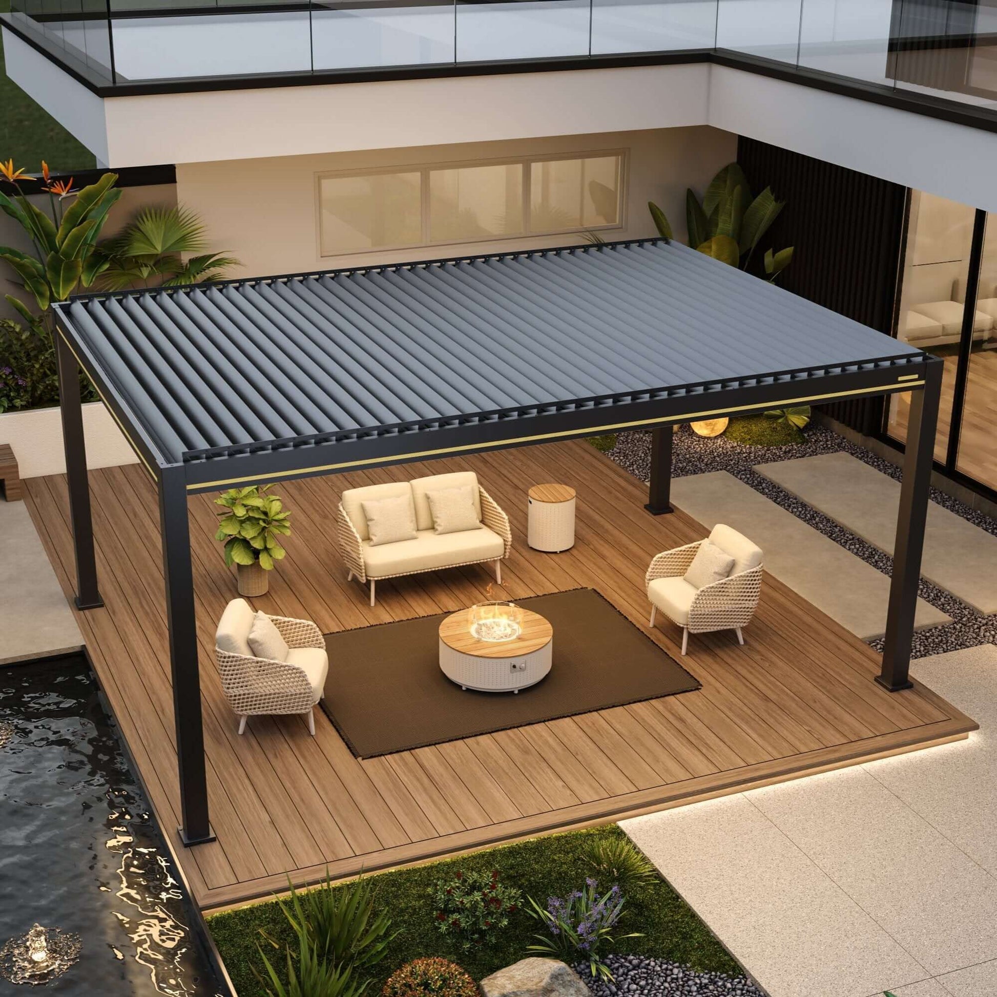 An overhead rendering of an outdoor lounge area featuring a black electric louvered pergola. Below, there’s a set of light beige outdoor lounge furniture, including a two-seat sofa and two beige woven armchairs, all with light-colored cushions. In the center of the seating area, there’s a round coffee table with a gas fire pit in the middle, surrounded by a transparent glass wind guard.