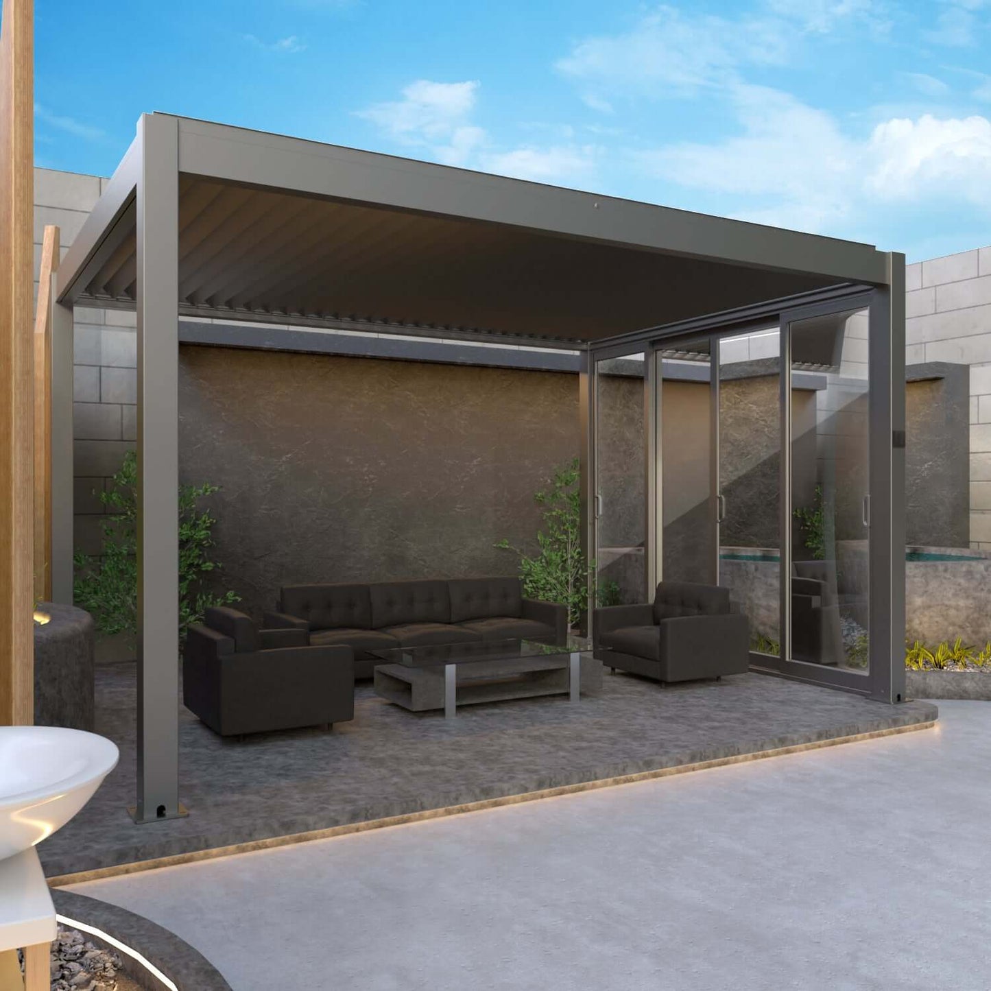 The dark gray Bon Pergola features fully closed louvers, creating a solid roof for complete shade. Its structure is built with thick dark gray beams and posts, forming a semi-enclosed outdoor space. One side is fitted with Bon Pergola Premium Sliding Glass—multi-panel glass sliding doors with dark gray frames. The doors are partially open, blending indoor comfort with outdoor living.