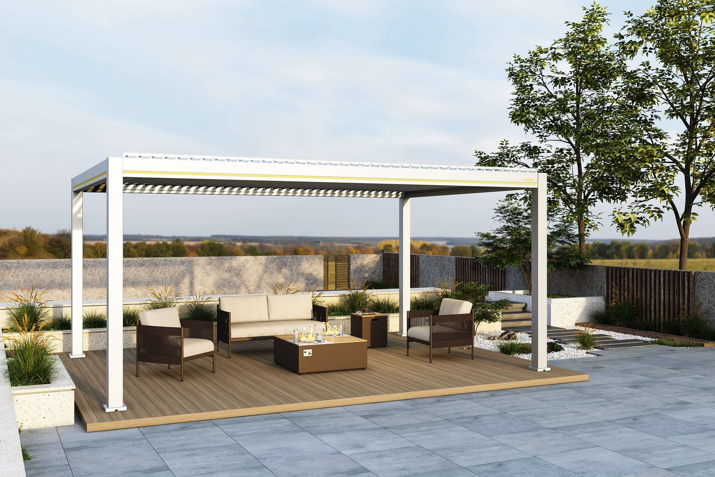 A white Villa Pergola with the louvers partially open, featuring a yellow decorative trim along the top. Beneath the pergola is a beige sofa with a dark frame, two deep brown woven armchairs with light-colored cushions, and a wooden fire pit table. The table has a gas fire pit in the center, surrounded by a transparent glass wind guard.
