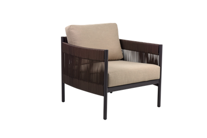 A single armchair with a dark metal frame and woven dark brown panels on the sides and back. It comes with a thick light beige seat cushion and a matching square back cushion.