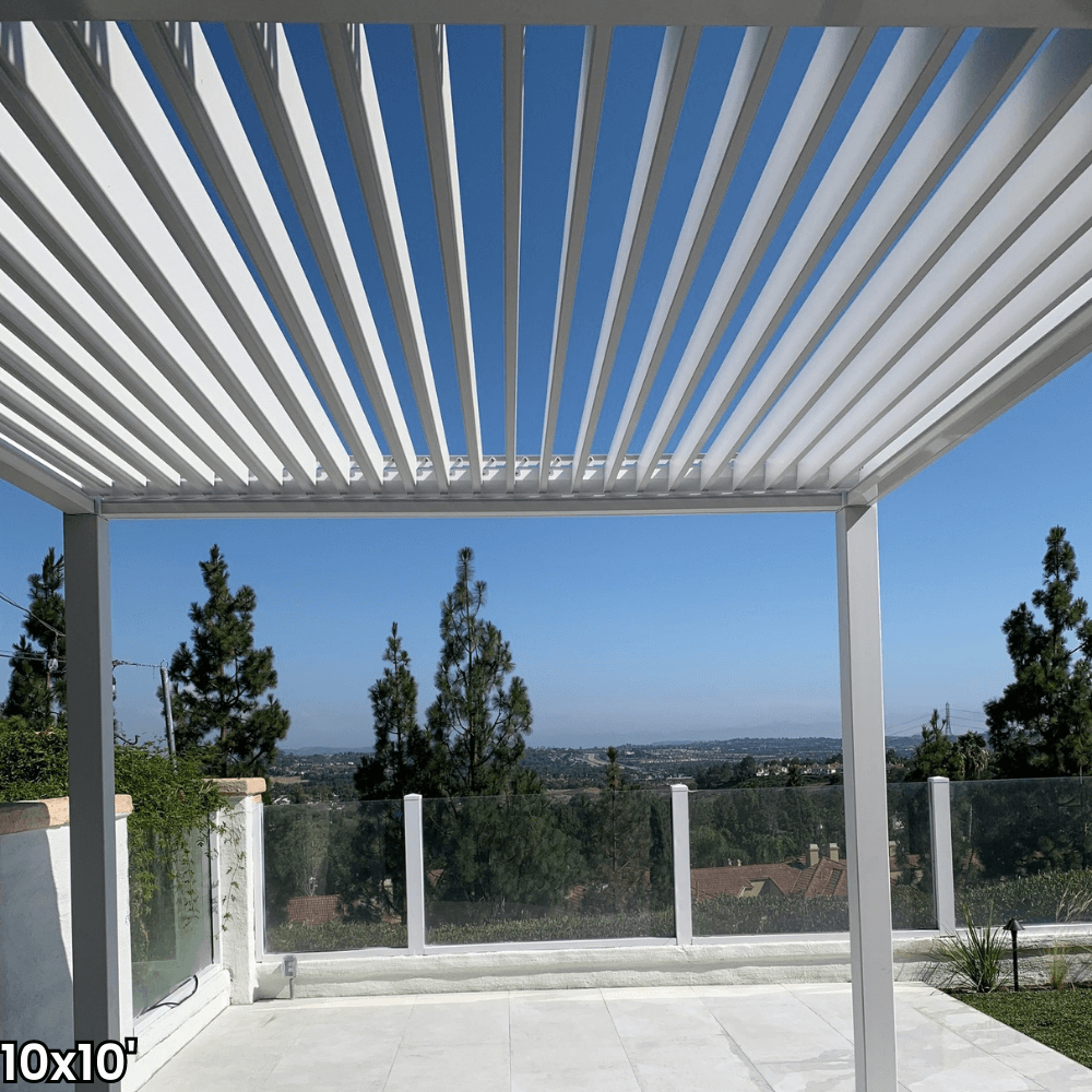 A white aluminum pergola with a motorized louvered roof and LED lighting. Perfect for shade, sun protection, and outdoor gatherings.